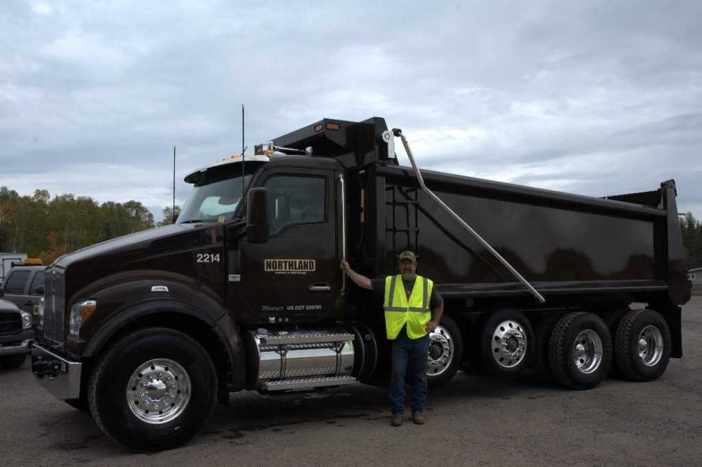 Field Worker in front of Truck